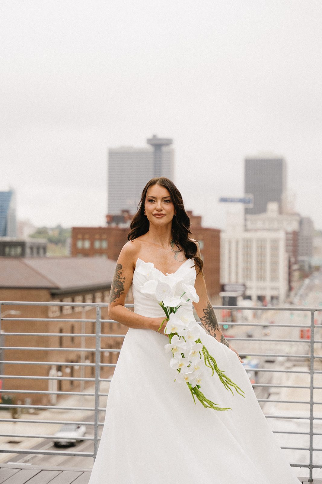 Bride on a rooftop with a bouquet