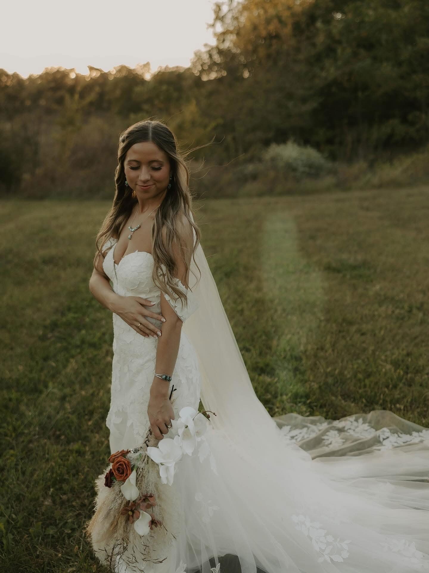 Outdoor bride in autumn light with soft waves