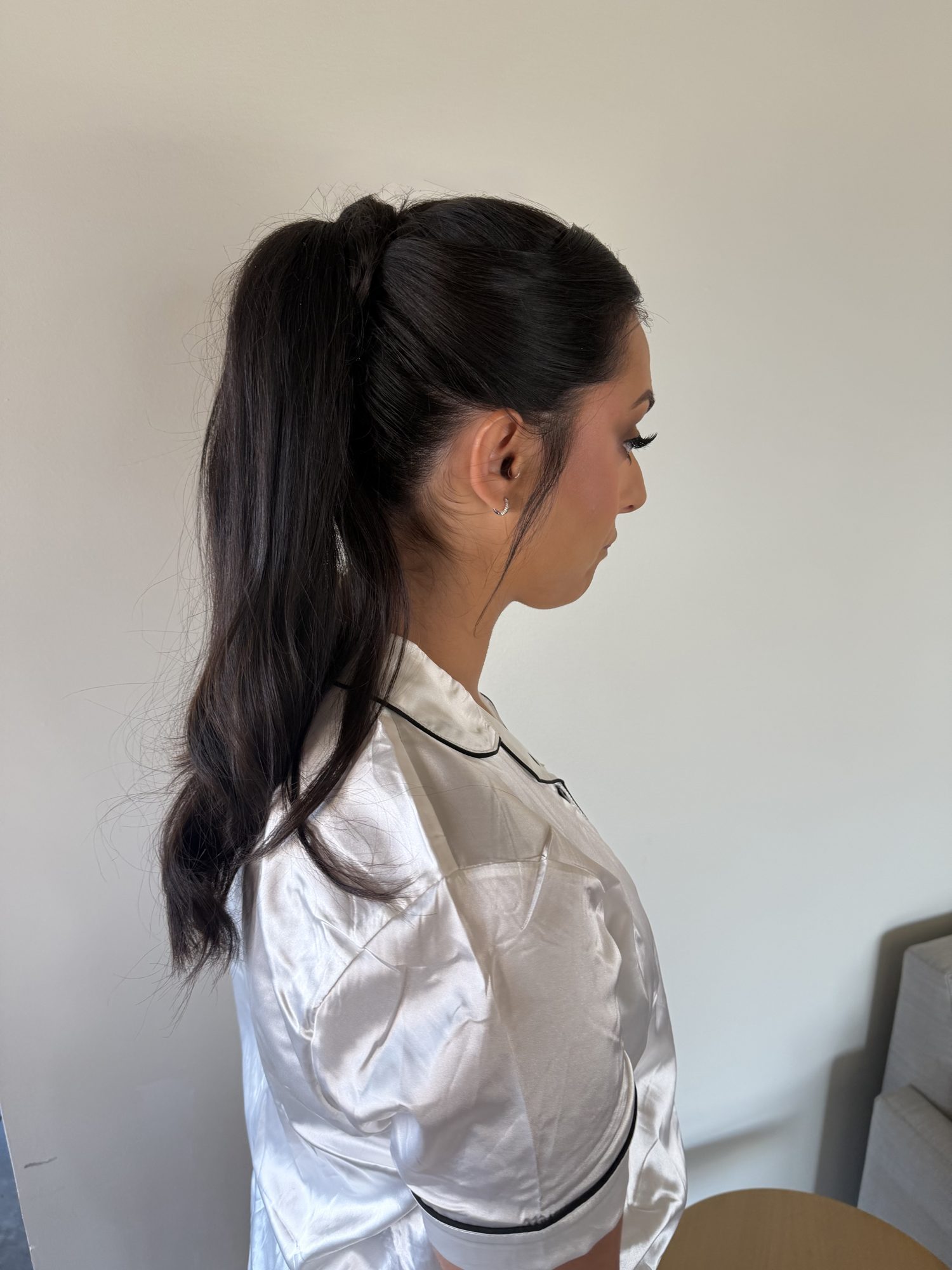 Sleek low ponytail in a getting-ready robe