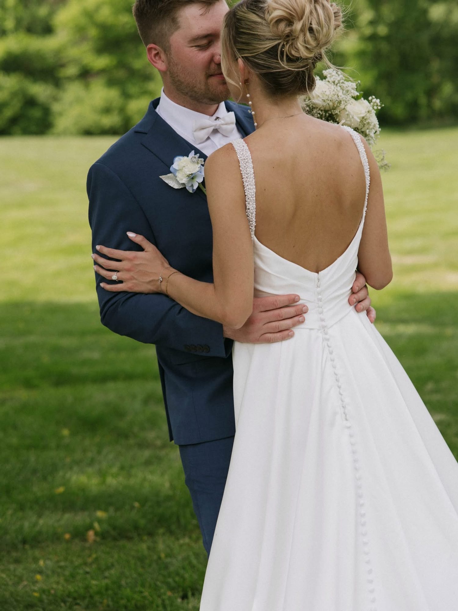 Bride from behind with a floral updo
